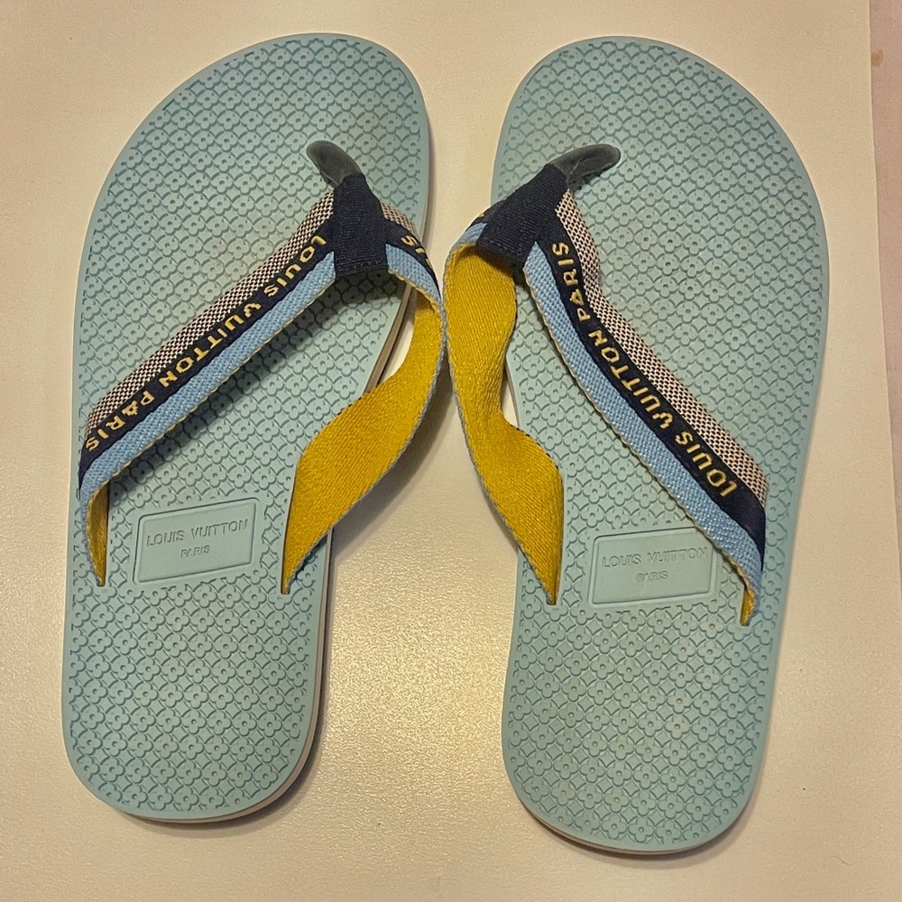 Louis Vuitton slide or flip flops.